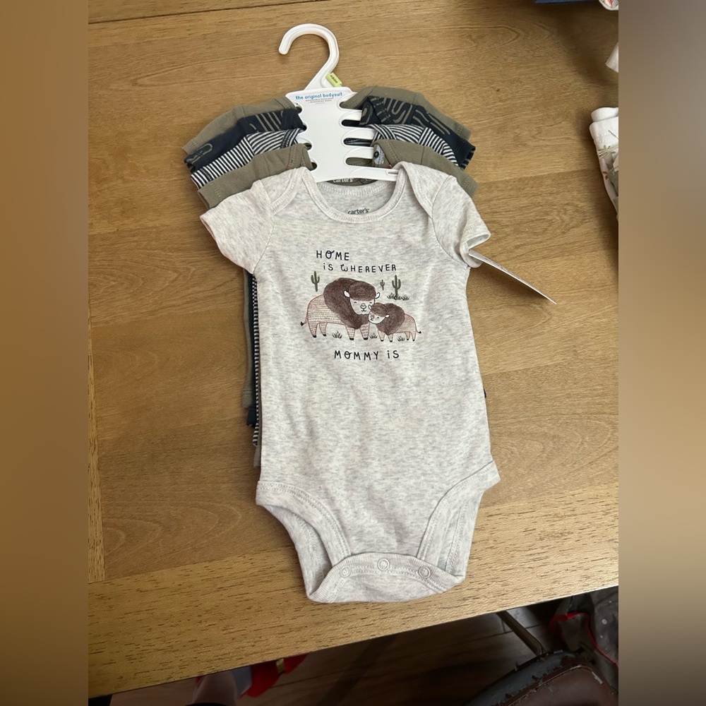 BRAND NEW 
3 months body suits